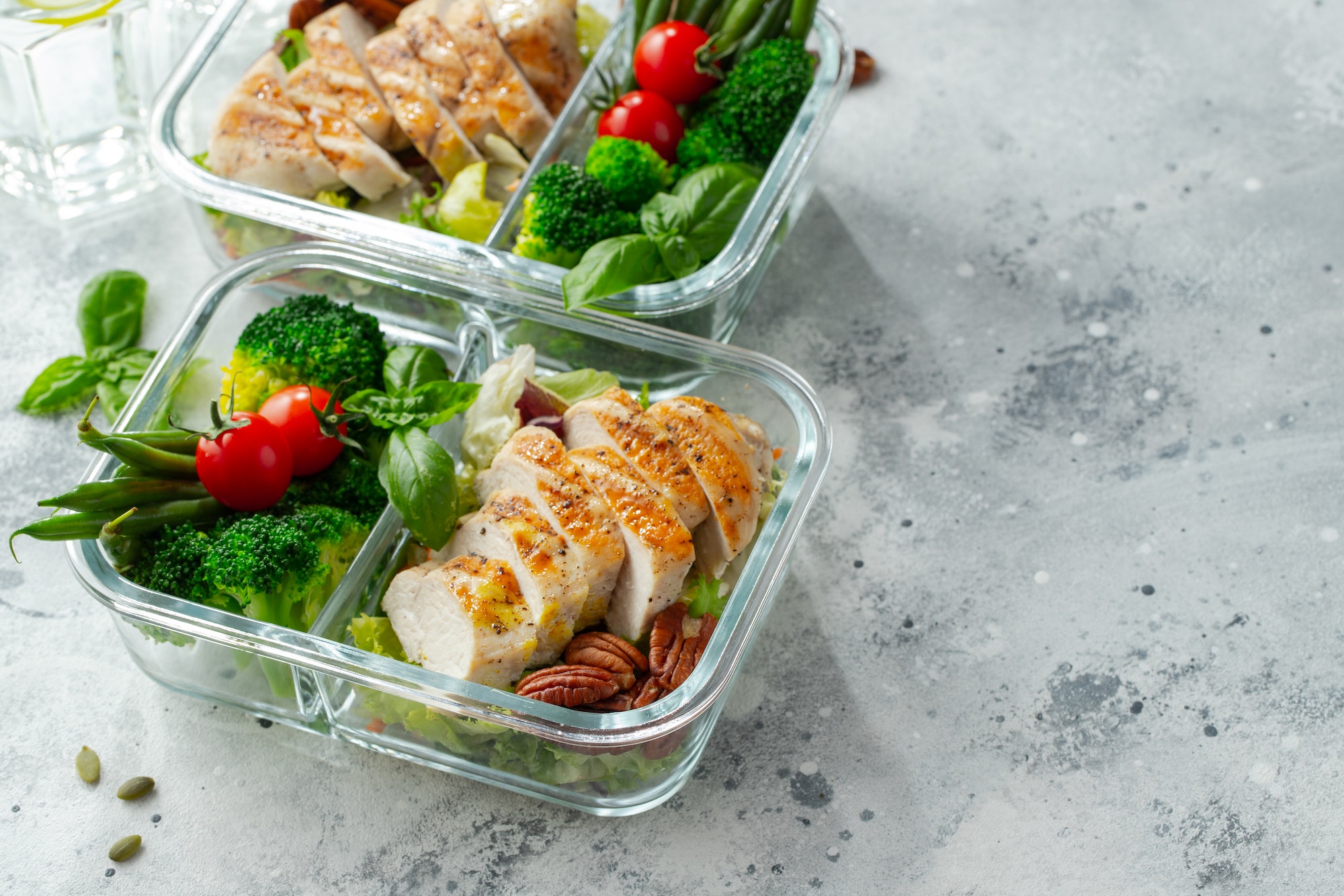 Healthy meal prep containers with chicken breast